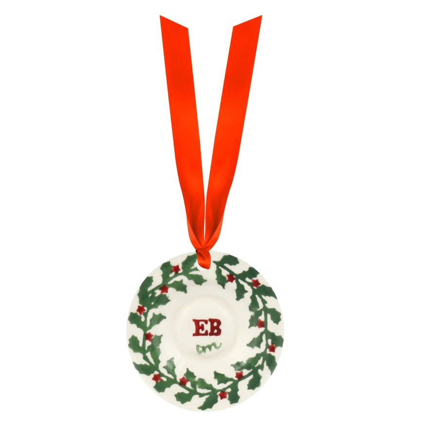Decorative Christmas ornament with a red ribbon on a white background