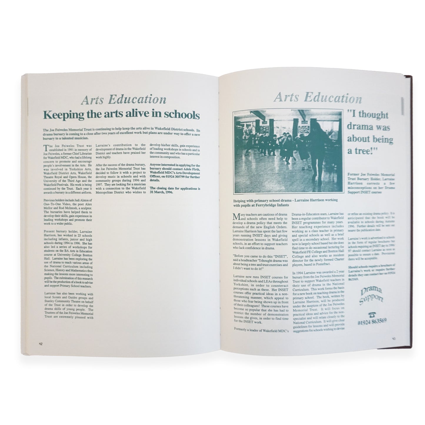 An open book featuring text heavy pages in a blue colour