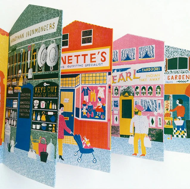 Illustrated city street scene with various shops and people.