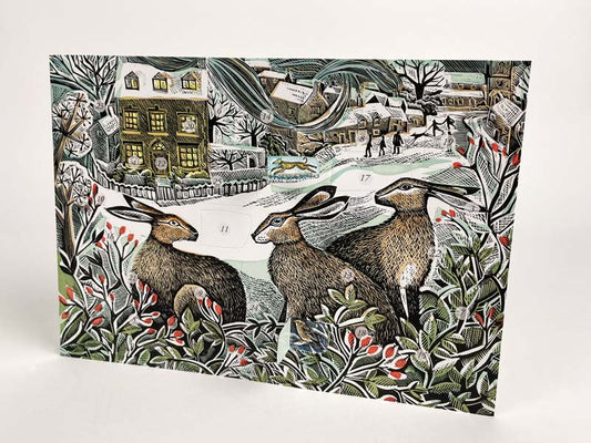 An illustrated advent card depicting three hares in a wintry landscape with holly and berries.