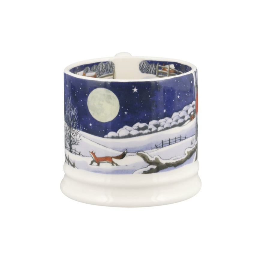 Ceramic mug with winter scene design on a white background