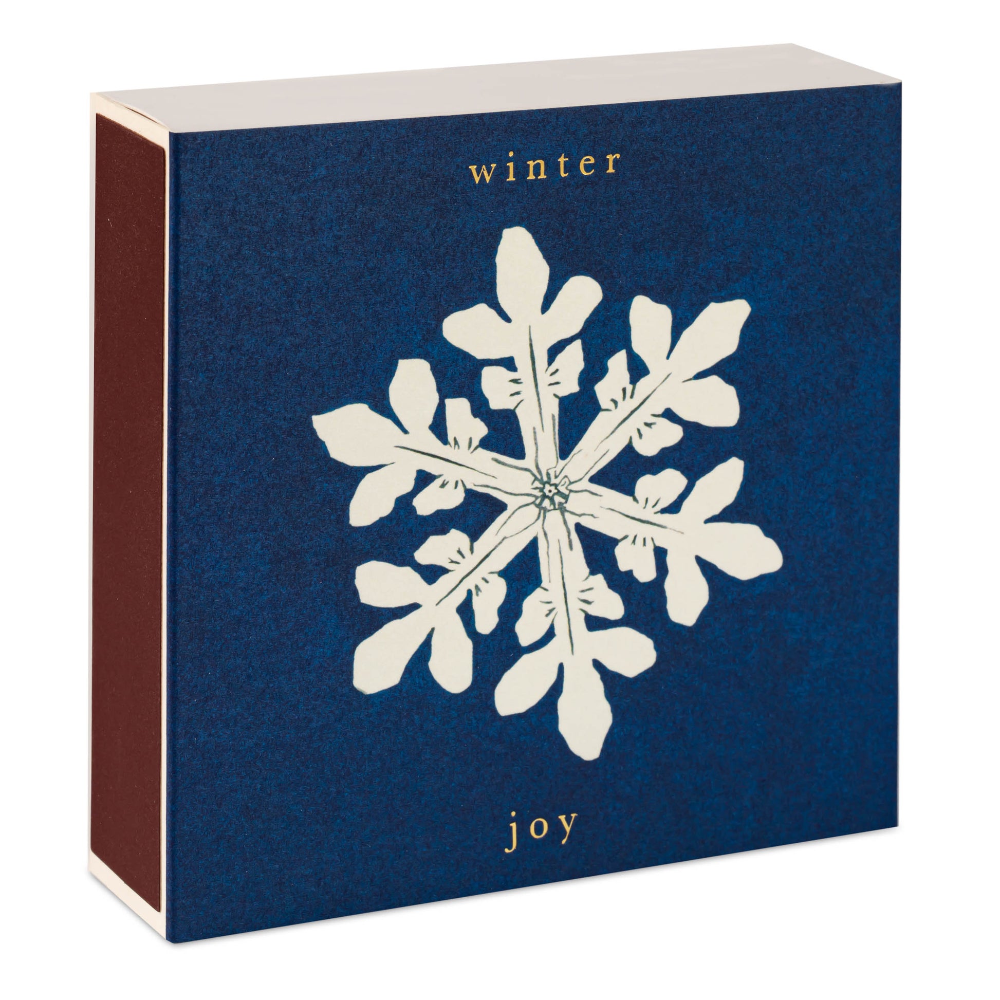 Box with a white snowflake design and 'winter joy' text on a blue background