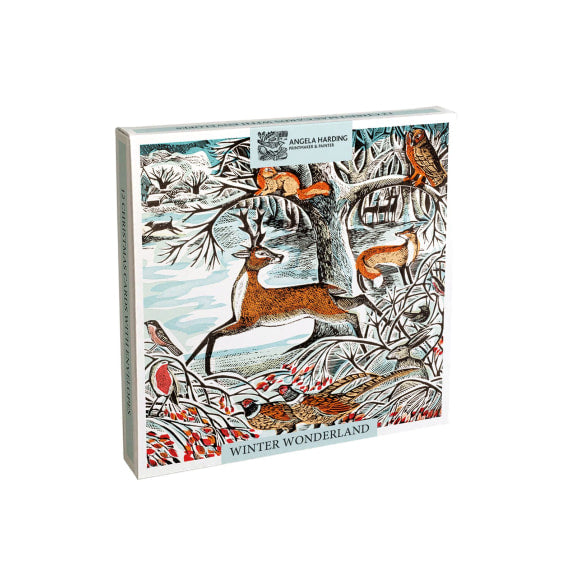 A boxed set of 12 Christmas cards titled 'Winter Wonderland' by Angela Harding, featuring a whimsical winter forest illustration with a deer, fox, owl, and birds on a white background.