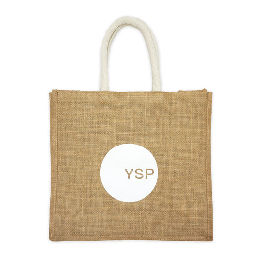 Beige jute bag with printed 'YSP' logo in white on a plain white background
