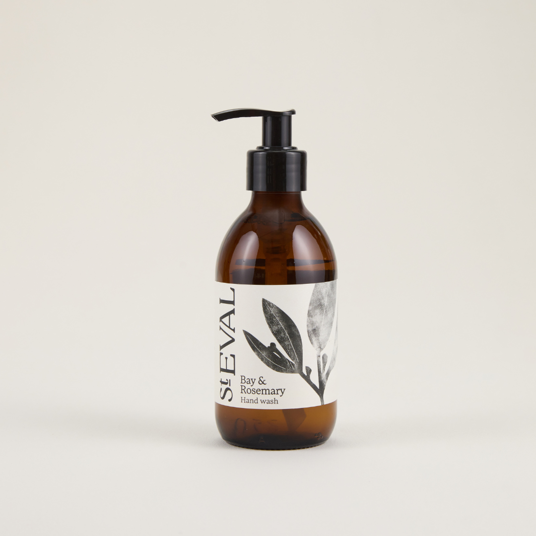 Brown bottle with pump and white label on a beige background