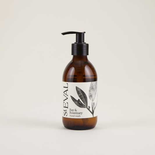 Brown bottle with pump and white label on a beige background