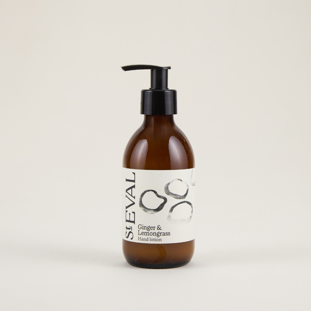 Brown bottle with pump and white label on a beige background