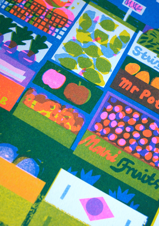 A vibrant illustration of a market stall filled with various fruits and vegetables. Items include bananas, string beans, and rhubarb, with a sign saying "Please help yourself" and a playful "Mr Potato" label. The background is bright blue.