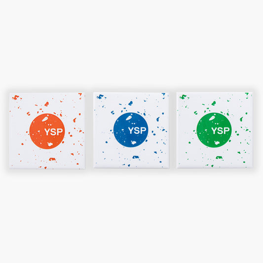Three square fridge magnets featuring a central circle with the letters "YSP" in white. The left canvas has an orange background with splatters, the middle one is blue, and the right one is green, each with a similar splatter design.