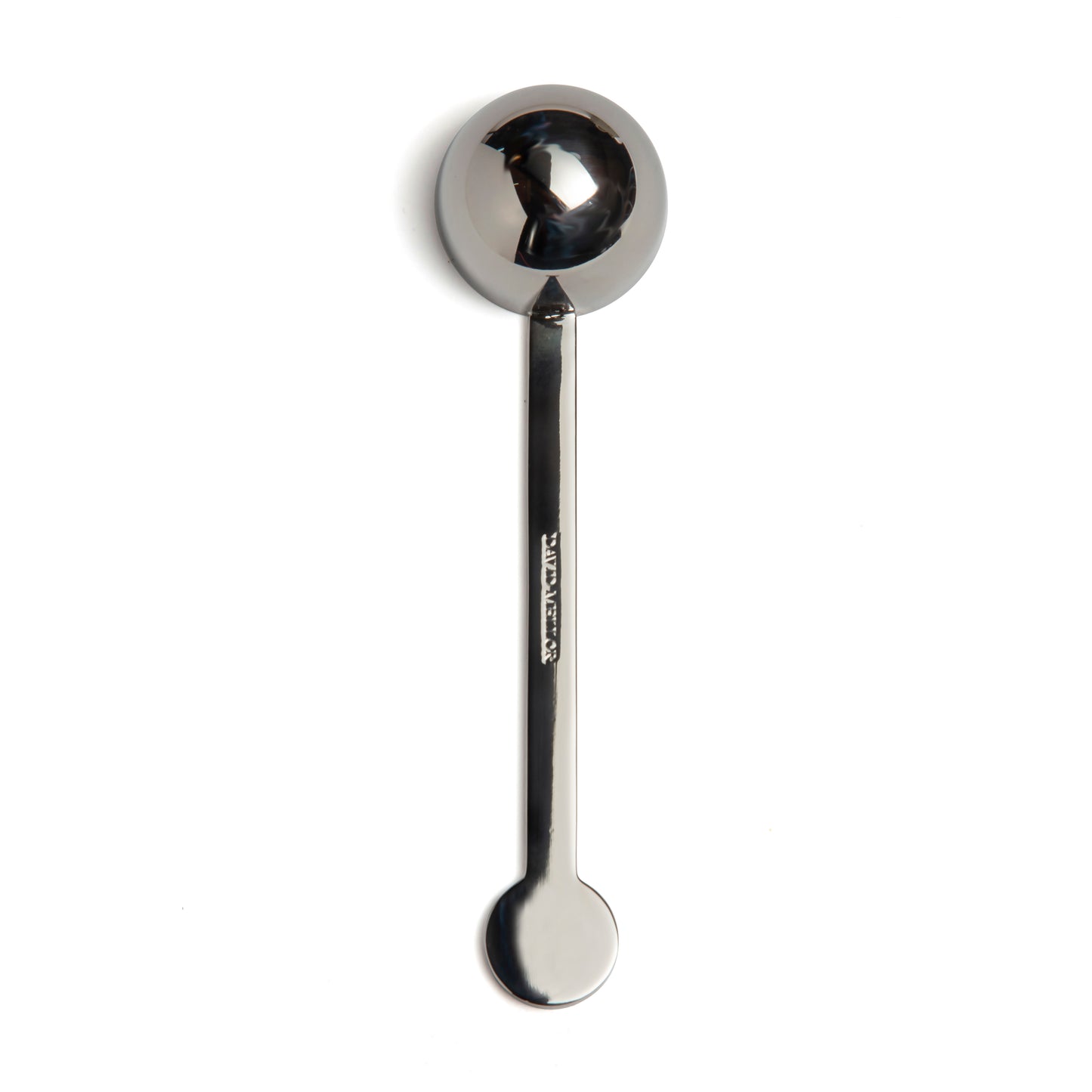 A stainless steel measuring spoon with a round bowl and a long handle, positioned vertically against a plain white background. The spoon has a polished finish, reflecting light subtly.