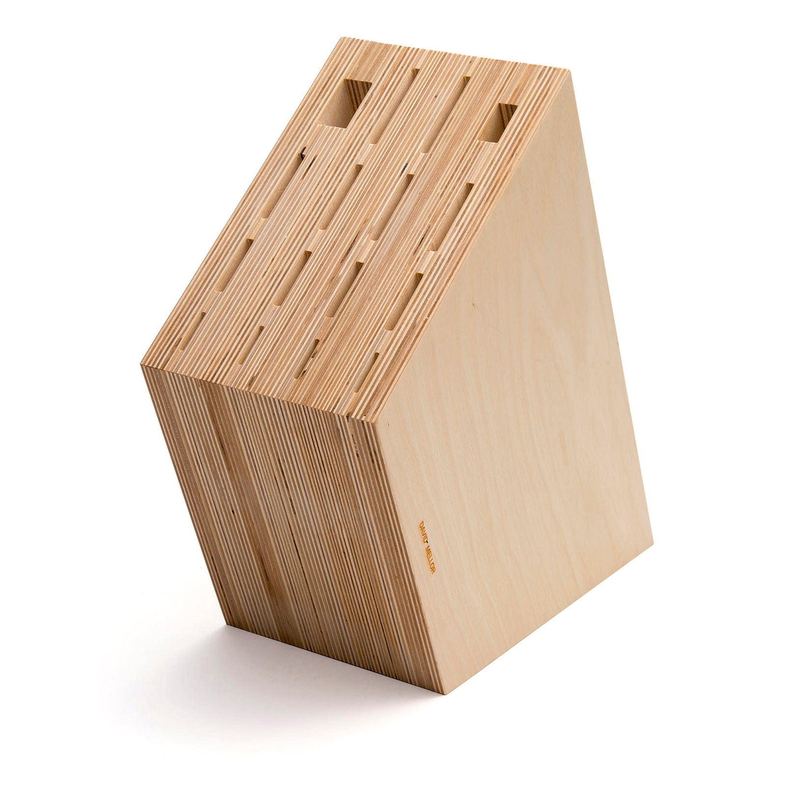 A geometric wooden structure made of layered plywood, resembling a small house. It features two rectangular cut-outs at the top and a slanted base, showcasing a minimalist design with a natural wood finish.