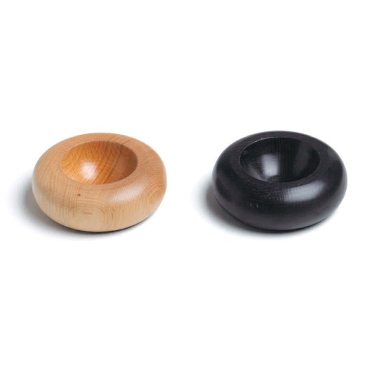 A pair of small, round wooden bowls. One is light-coloured, showcasing a smooth, natural wood finish, while the other is dark, with a polished surface. Both bowls have a shallow centre, ideal for holding small items or as decorative pieces.