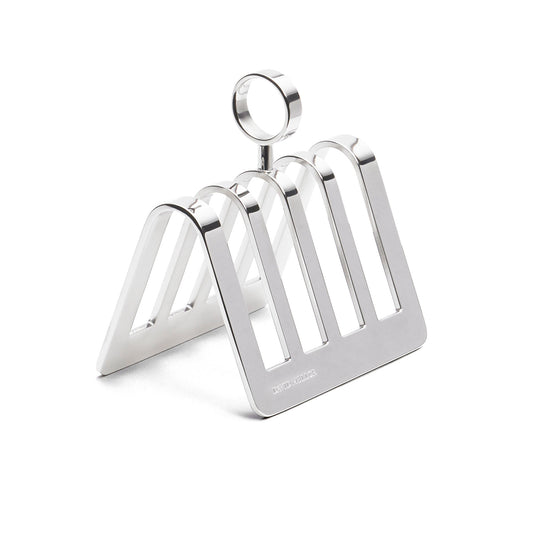 A sleek, silver metal toast rack with a modern design. It features a triangular shape with four vertical slots for holding toast, and a circular handle on top for easy lifting. The surface is shiny and reflective.