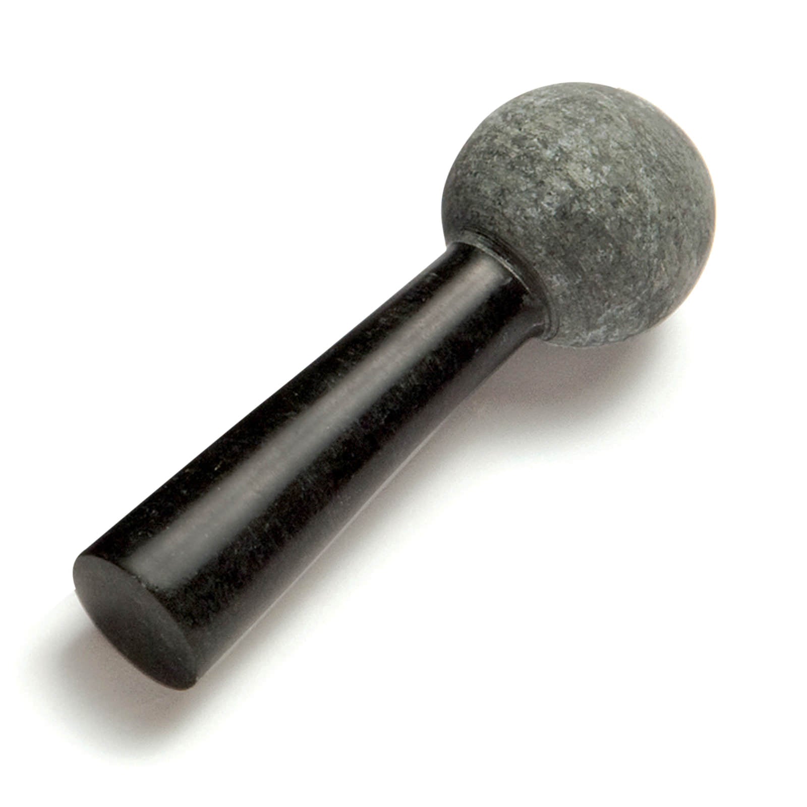 A small, round stone with a smooth surface is attached to a slender, black handle. The stone appears to be made of a dark, textured material, while the handle is shiny and polished, creating a contrast in textures and colours.